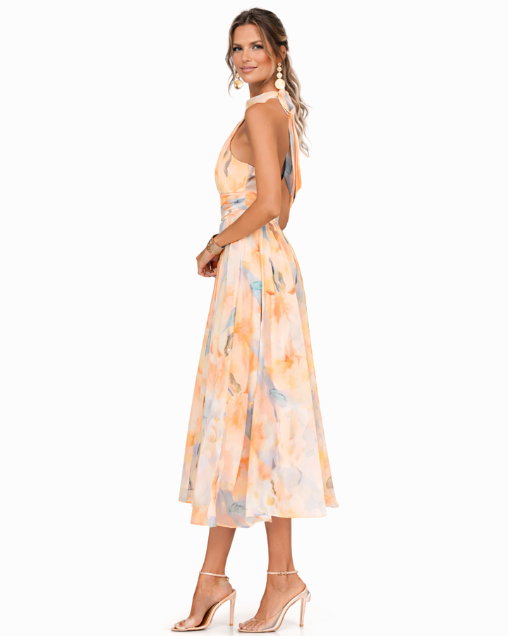 Adelaide halter neck printed midi dress, side view showing flowing skirt