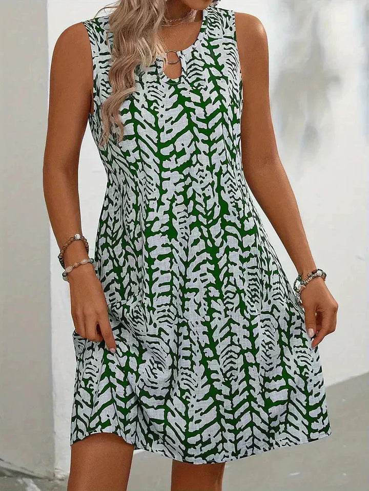 Adelaide printed mini dress in green colourway, front view