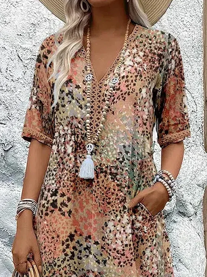 Cecily boho printed V-neck midi dress, close-up of neckline and sleeve trim
