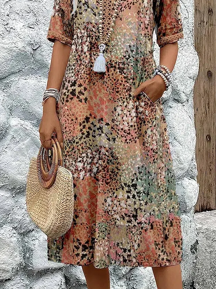 Cecily boho printed V-neck midi dress, close-up of pocket and skirt detail