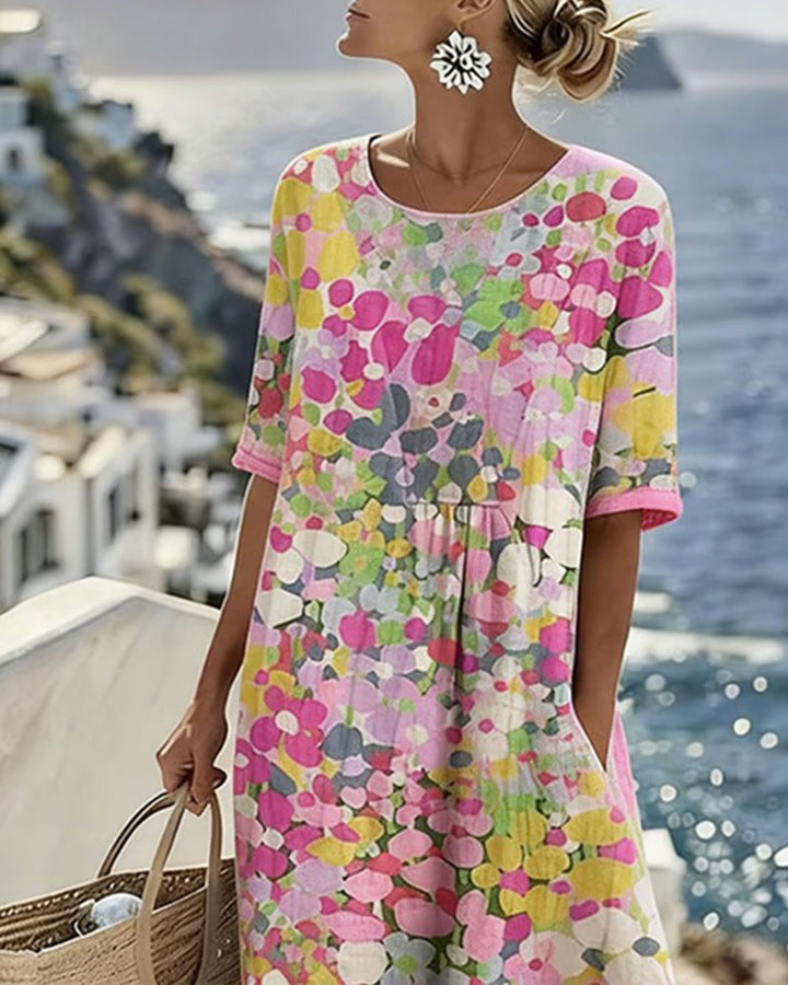 Coraline floral print midi dress, close-up on model with straw bag
