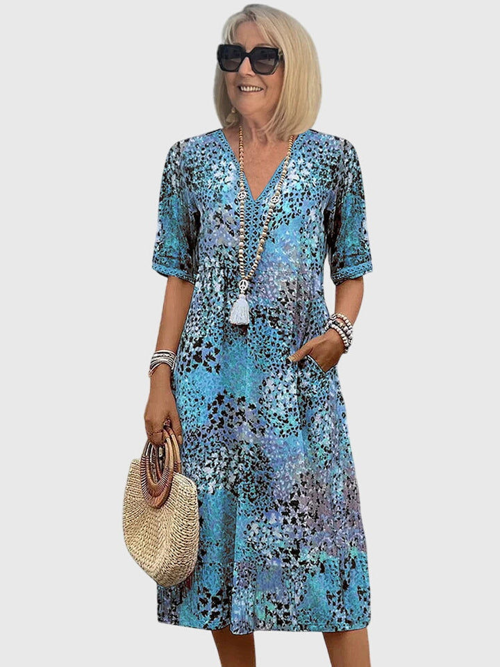 Fern boho printed V-neck midi dress in blue tones, front view