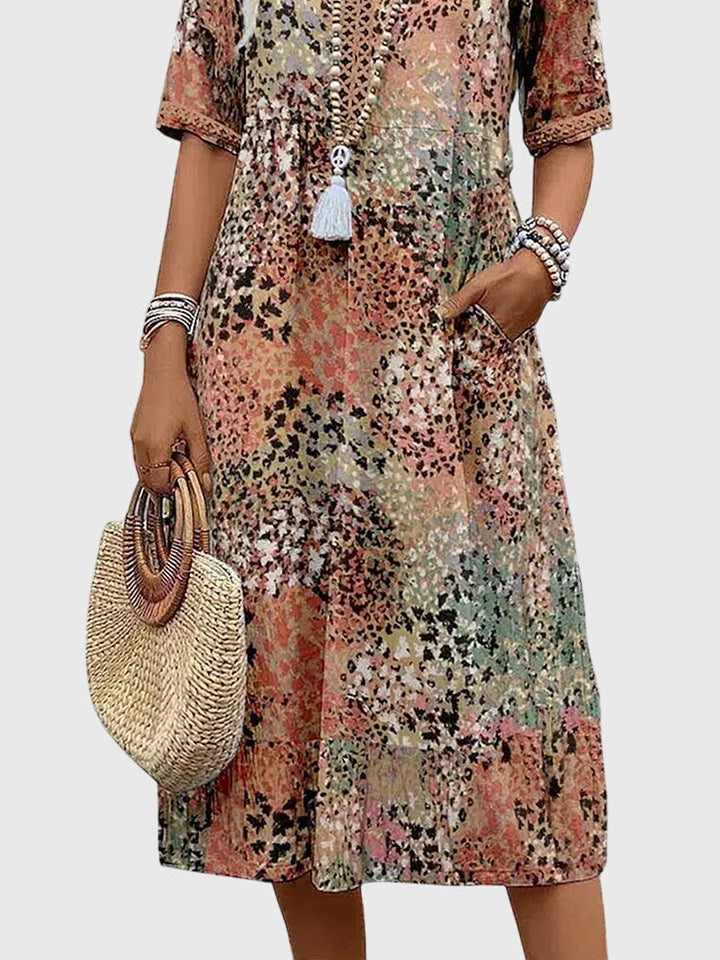 Close-up of Fern midi dress pocket and floral print detail