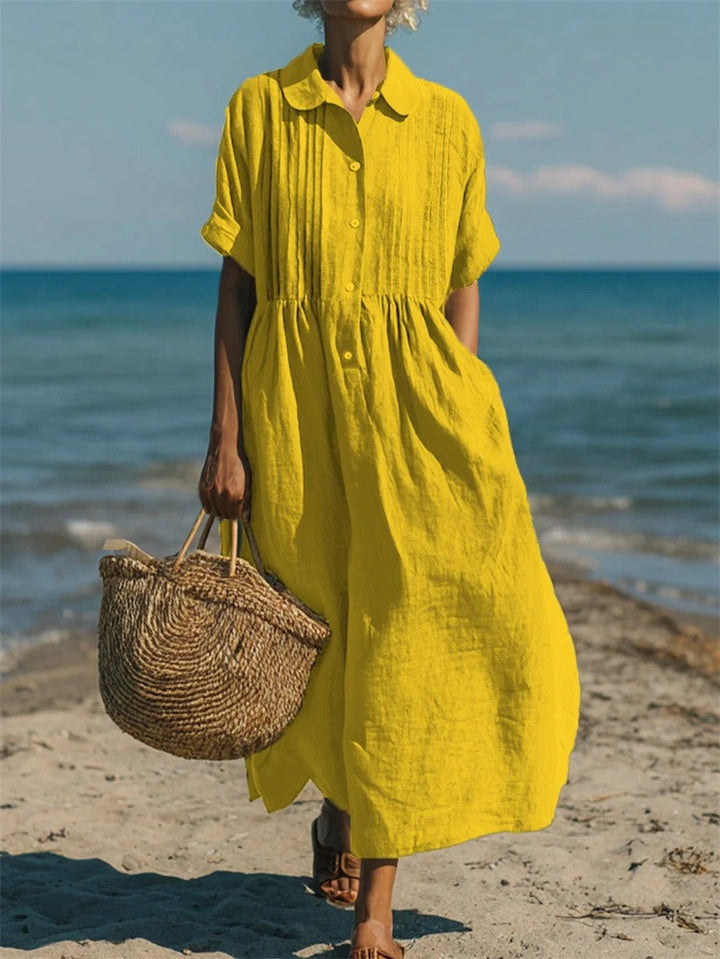 Florence yellow collared button front maxi dress, front view on beach