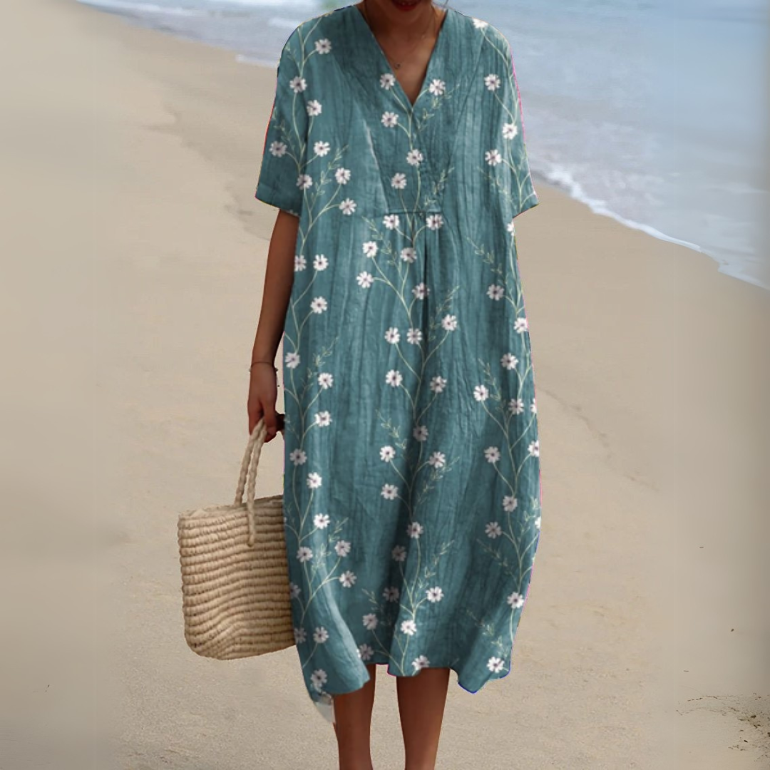 Florence teal floral print V-neck midi dress, front view on model at the beach