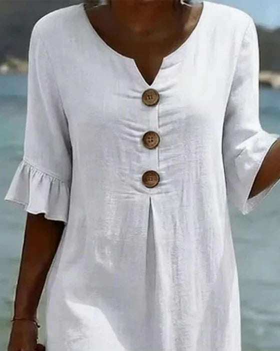 Marigold white dress neckline and button detail close-up