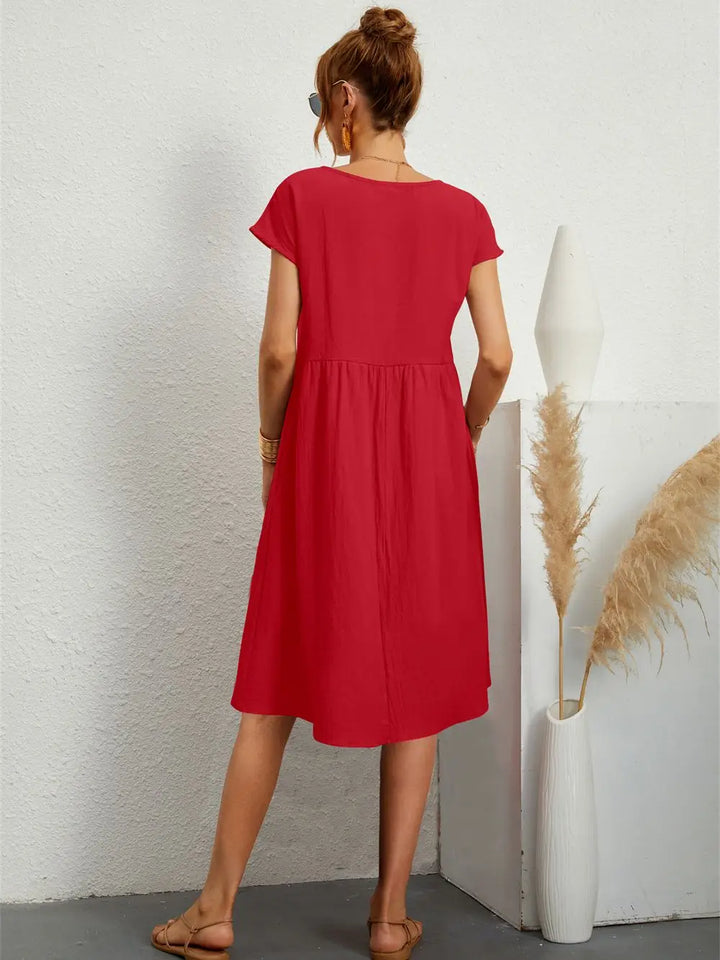 Odessa red midi dress, back view showing loose straight silhouette