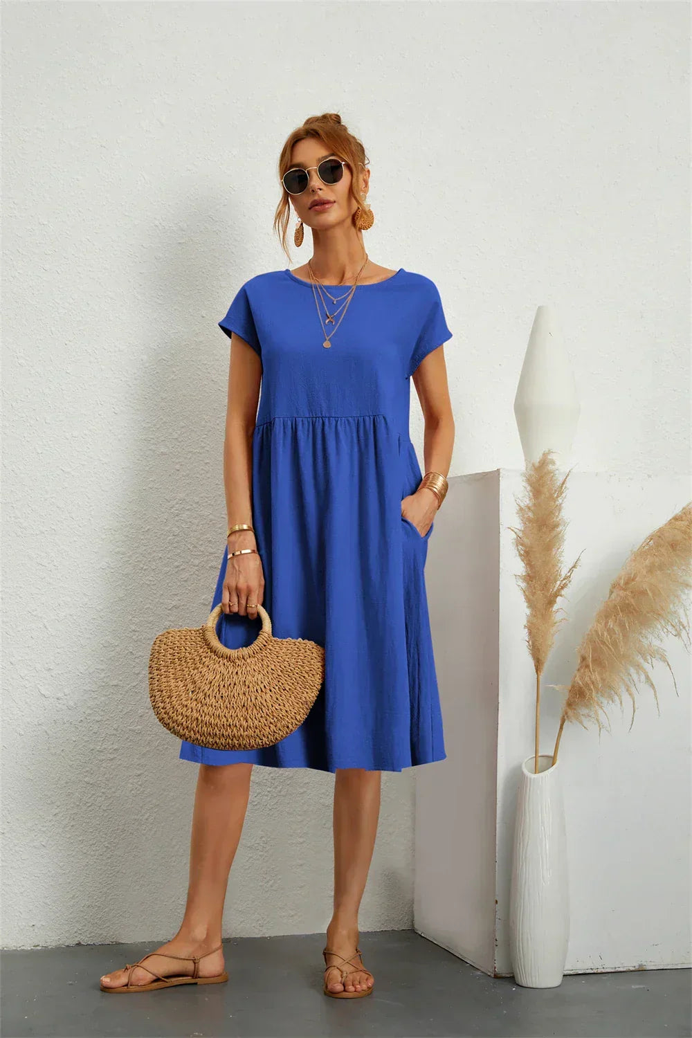 Odessa blue round neck short sleeve midi dress with pockets, front view