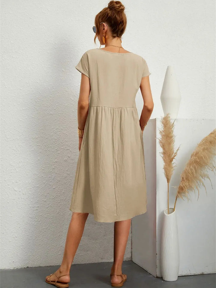 Odessa khaki midi dress, back view showing loose straight silhouette