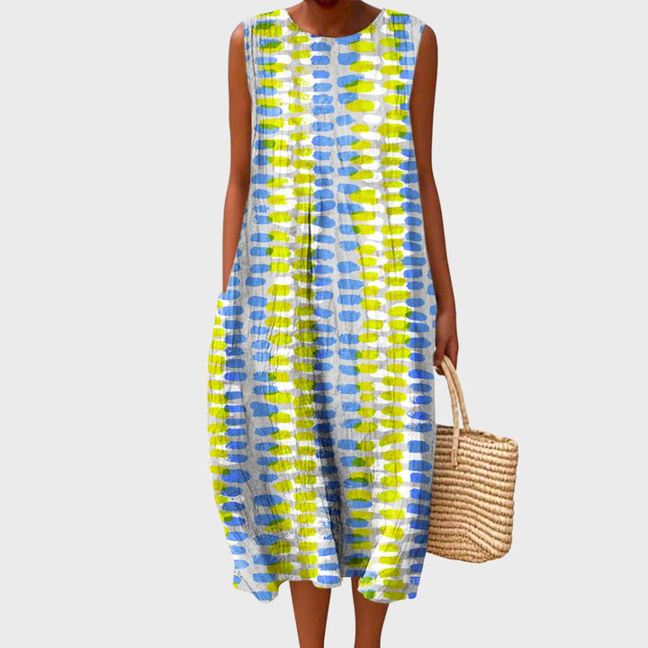 Rosalind printed sleeveless maxi dress, front view in blue and yellow dot pattern