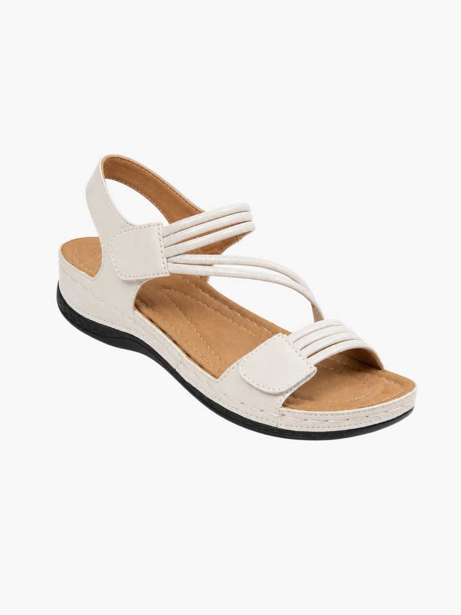Rosalind strappy adjustable wedge sandals in cream, angled view