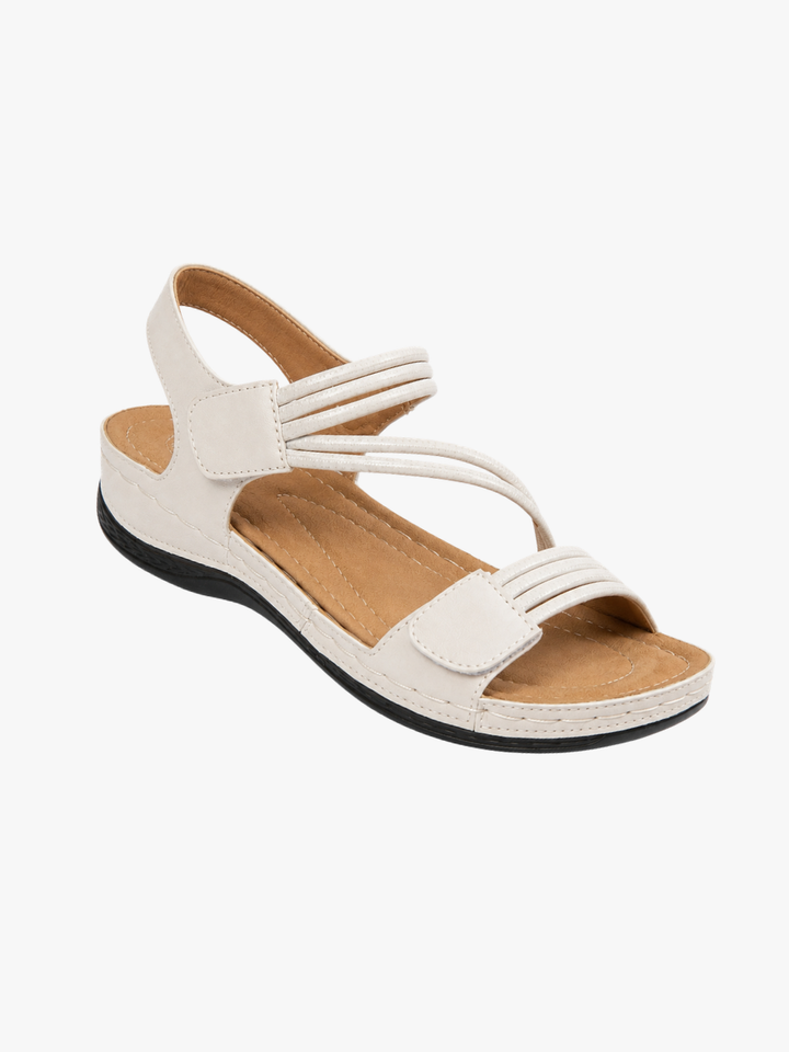 Rosalind strappy adjustable wedge sandals in cream, angled view
