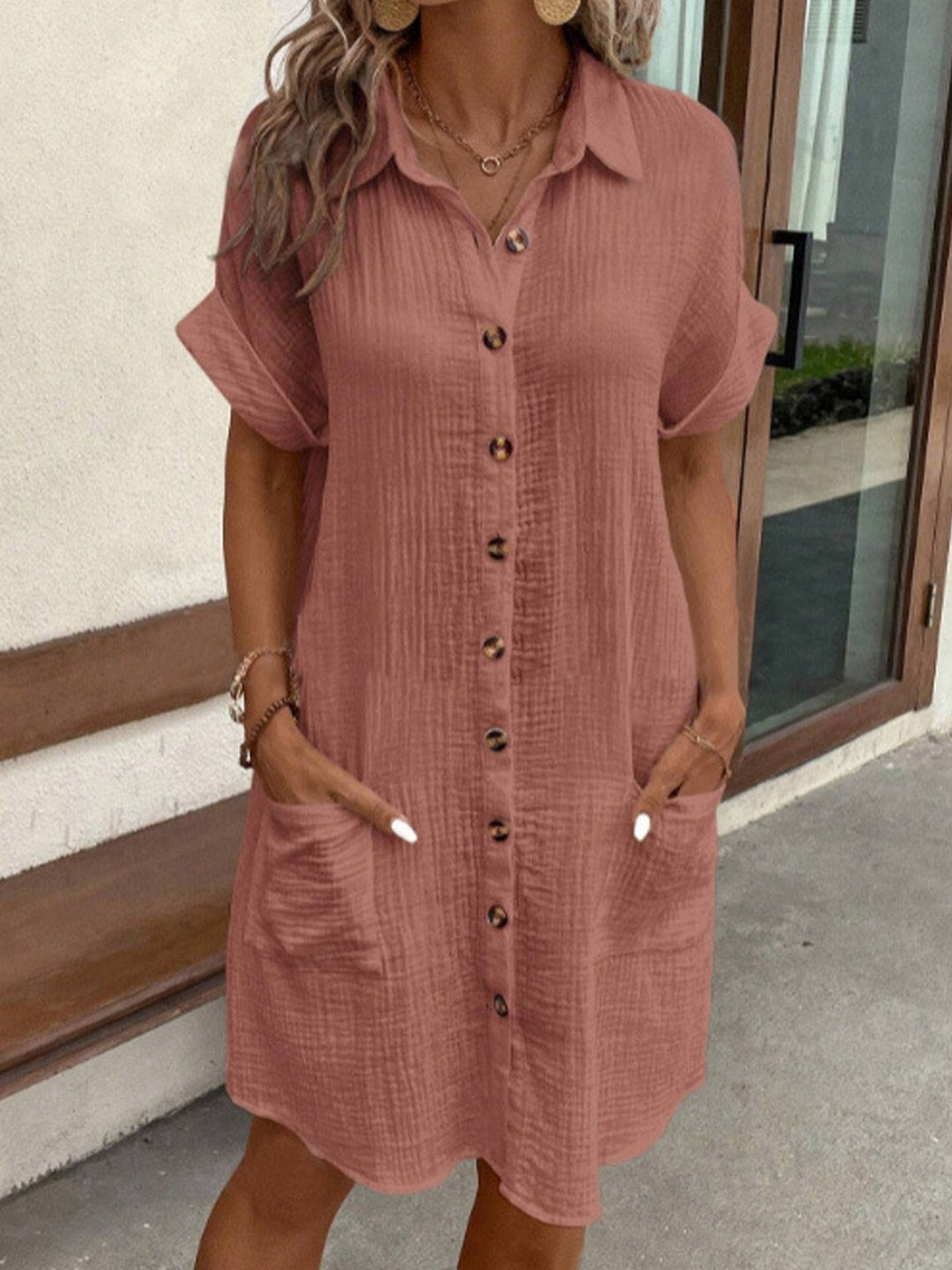 Sylvie terracotta button-down shirt dress with front pockets, close-up view